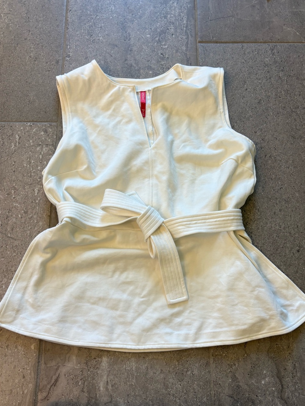 Cream Sleeveless Belted Peplum Top
